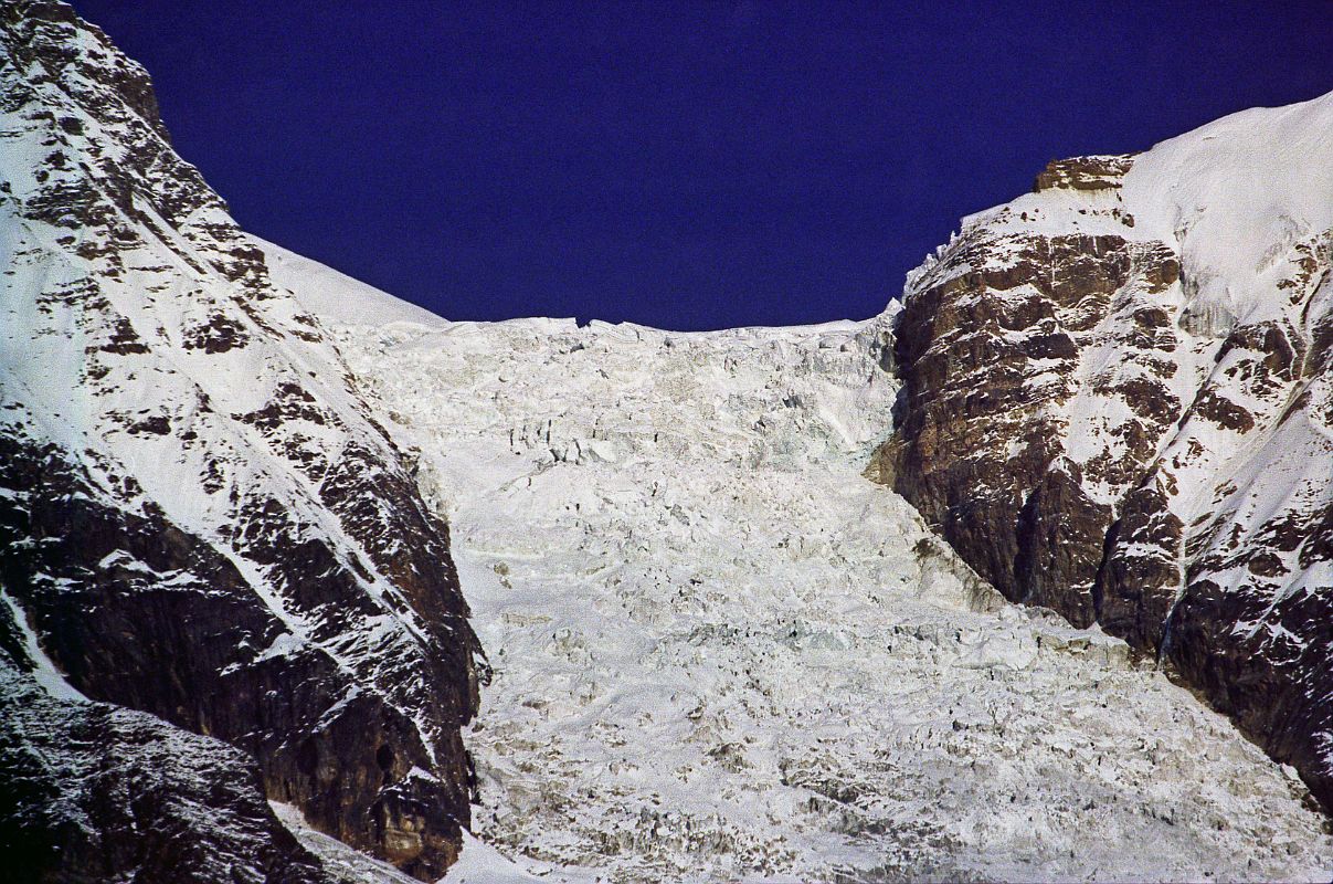 409 Dhaulagiri Icefall Close Up Early Morning From Lete The East glacier's a great torrent of ice. Rbuffat explained. Even supposing we did succeed in getting up the glacier, continued Lachenal, I don't quite see how we should get on to the north ridge. My own view is that we shouldn't try. It's a regular Walker (The north buttress of the Pointe Walker on the Grandes Jorasses is perhaps the most difficult climb in the Alps) with seracs stuck on!  ... These mountains are unclimbable! No expedition could ever get through this way [Dhaulagiri Icefall] (Maurice Herzog, Annapurna). Here is a close up view of the Dhaulagiri East Glacier from Lete.